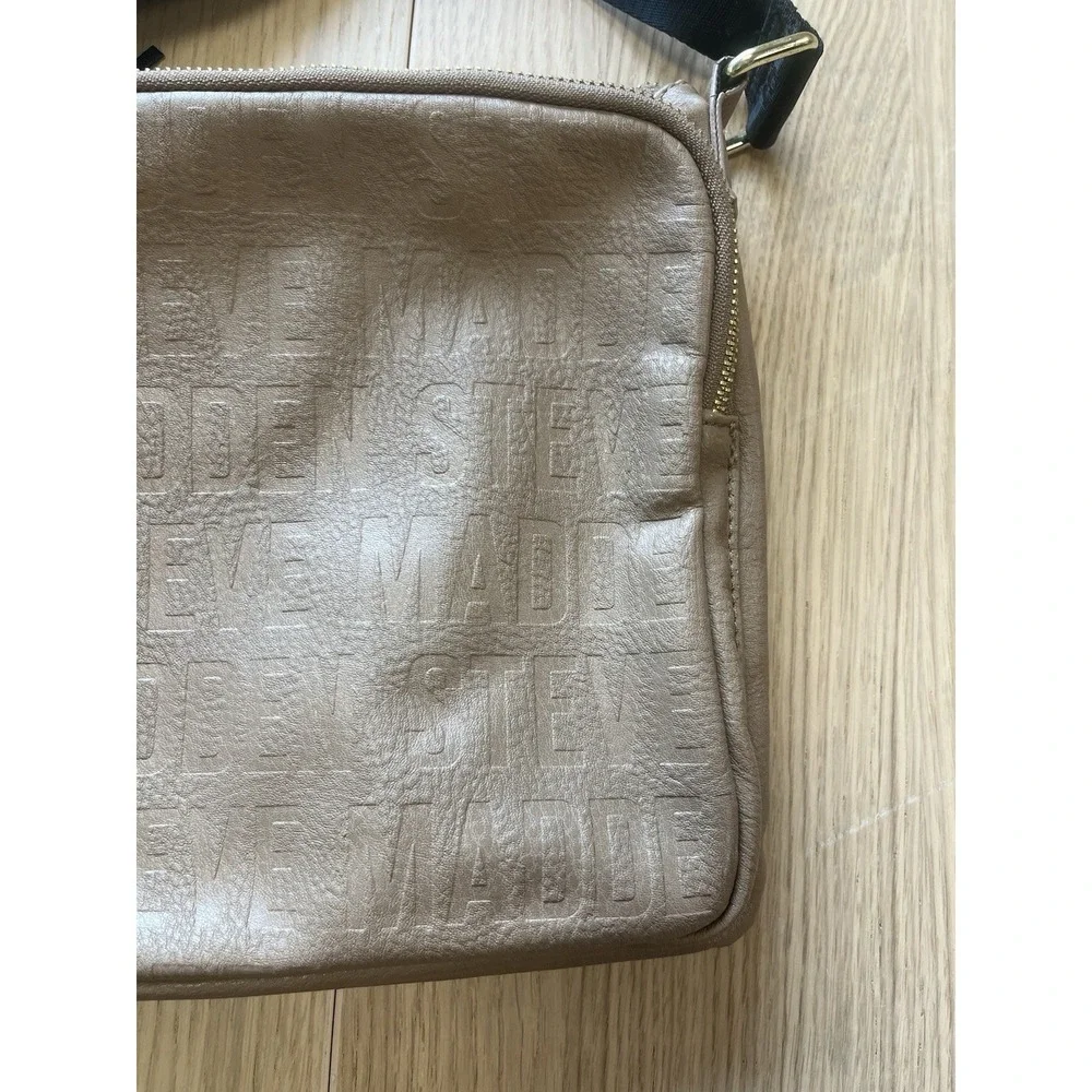 Steve Madden Taupe Embossed Logo Crossbody Bag Tassel Black Strap Gold Hardware
